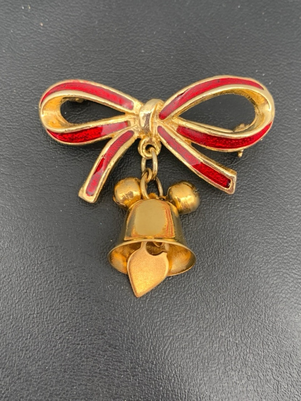 Vintage Christmas Gold-tone Bow and Bell Brooch with Red Enamel Accents